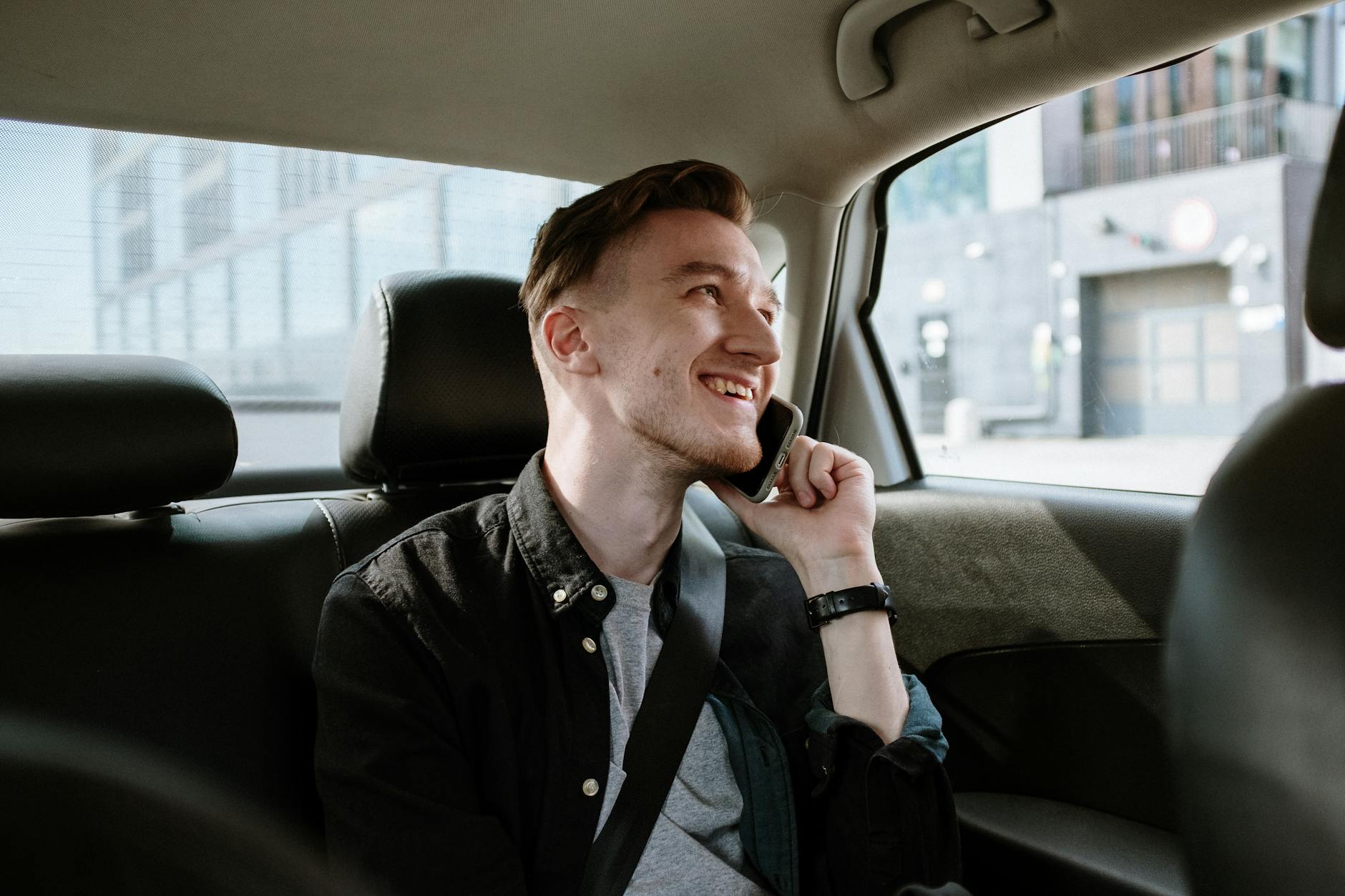 https://www.pexels.com/photo/man-in-black-jacket-sitting-inside-car-4606338/